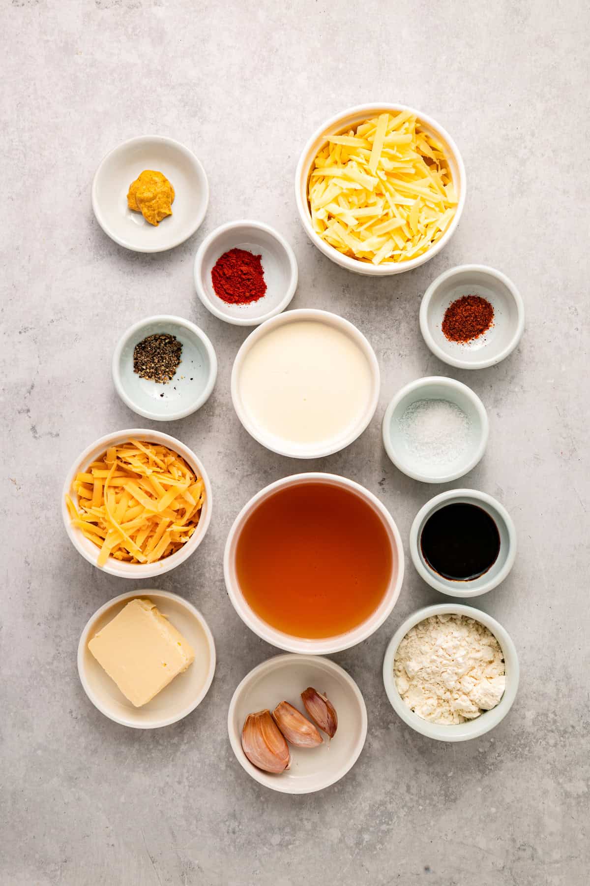 This Beer Cheese Dip is warm, sharp, and just a little smoky, with a combination of cheddar & gruyere and your favorite beer. Overhead view of ingredients needed to make beer cheese dip