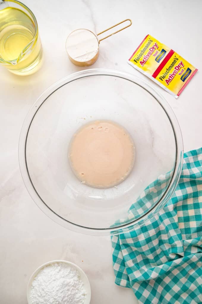 This Beignets recipe is an easy homemade version of the popular New Orleans fried square donuts. Soft & fluffy! Yeast proofing in a bowl