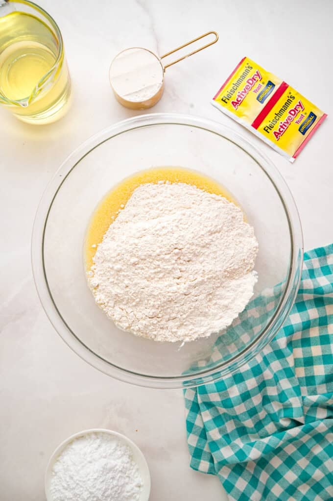 This Beignets recipe is an easy homemade version of the popular New Orleans fried square donuts. Soft & fluffy! Flour added to a yeast mixture