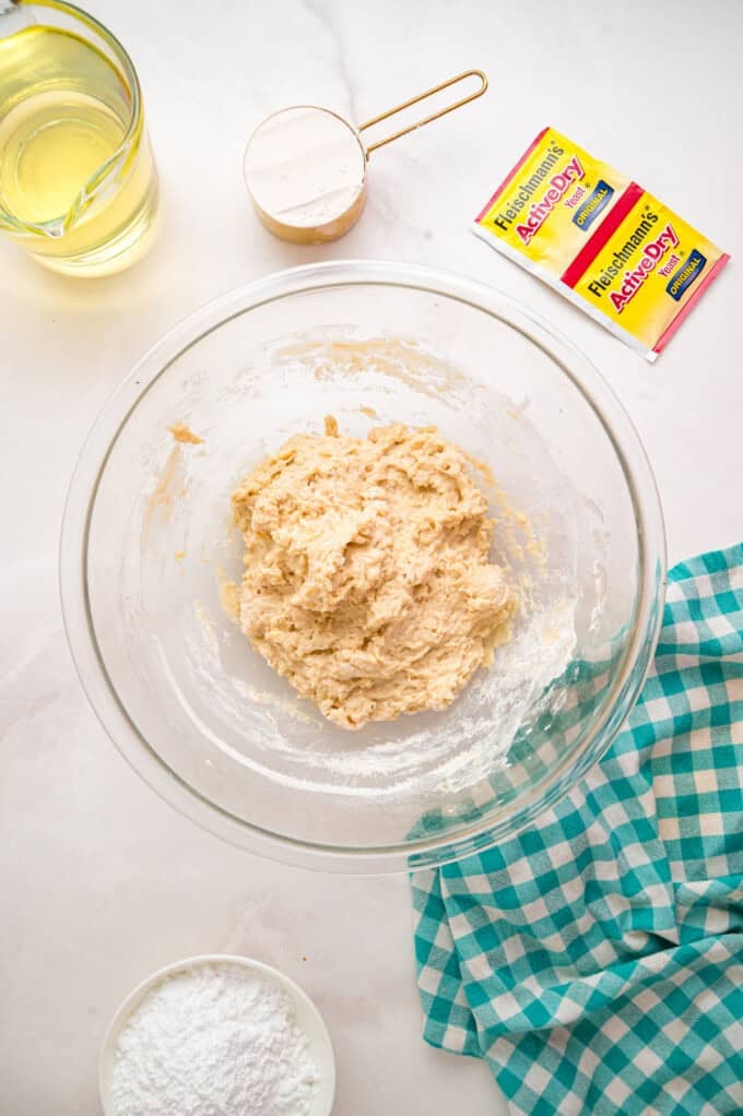 This Beignets recipe is an easy homemade version of the popular New Orleans fried square donuts. Soft & fluffy! Dough before it's been kneaded
