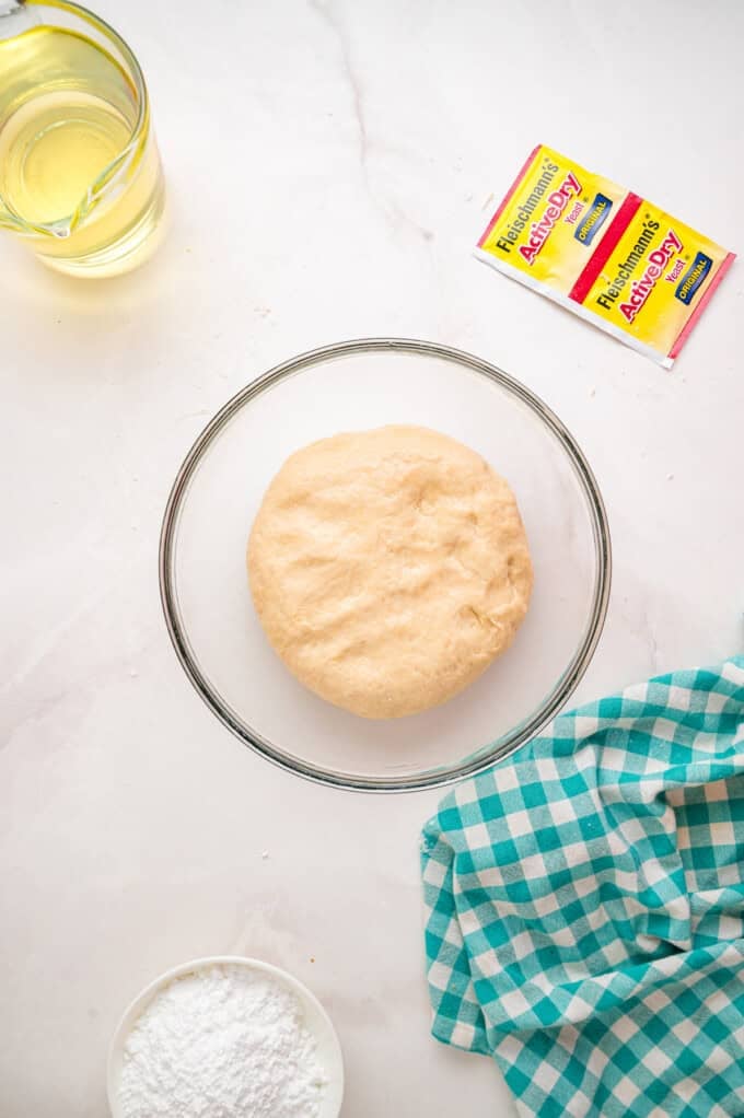 This Beignets recipe is an easy homemade version of the popular New Orleans fried square donuts. Soft & fluffy! A bowl of dough before it's risen
