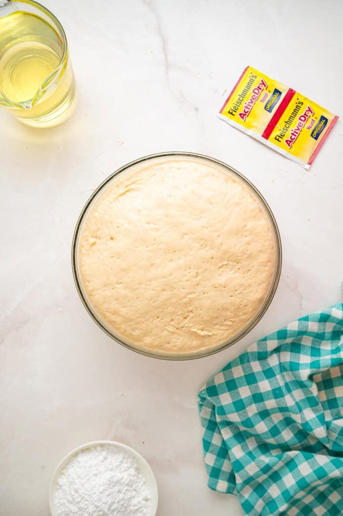 This Beignets recipe is an easy homemade version of the popular New Orleans fried square donuts. Soft & fluffy! A bowl of dough after it's risen