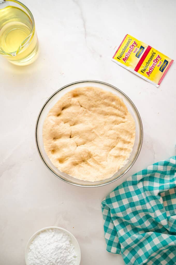 This Beignets recipe is an easy homemade version of the popular New Orleans fried square donuts. Soft & fluffy! Dough after it's been punched down