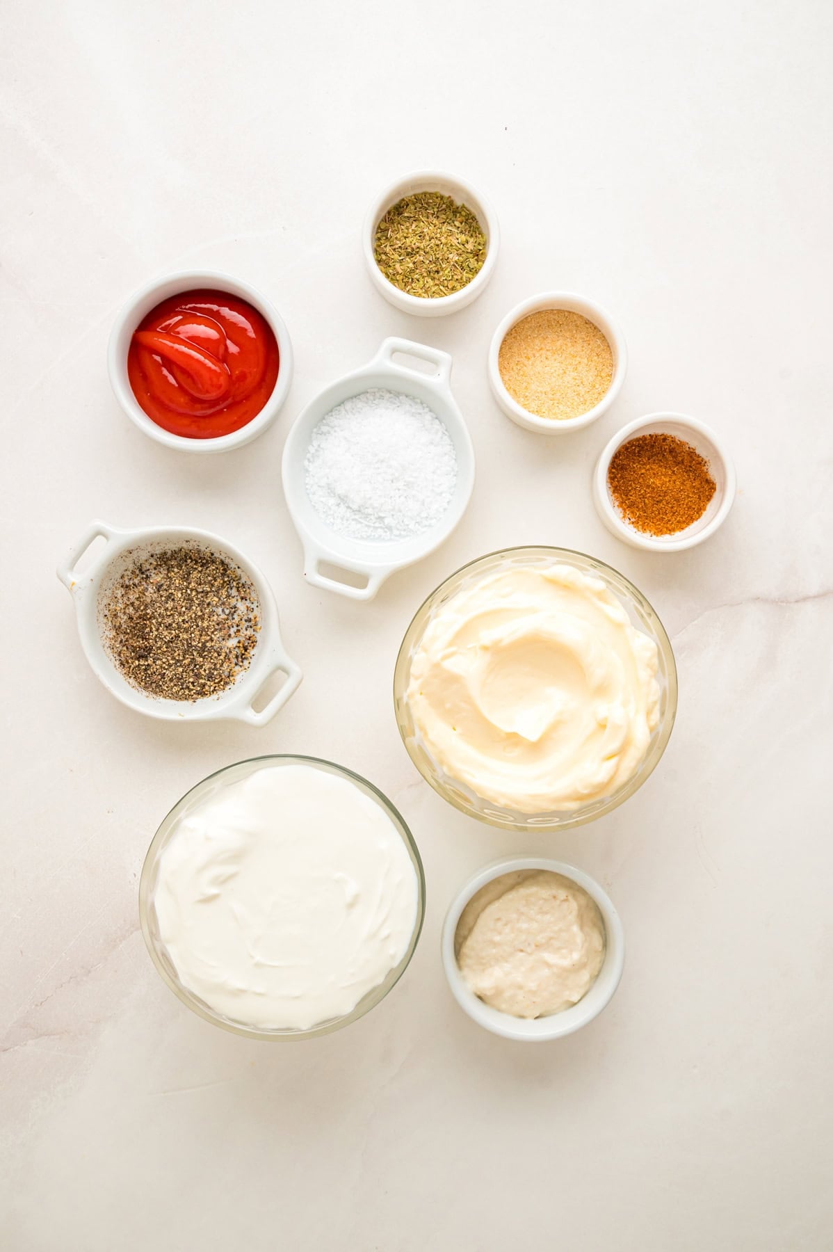 This copycat Outback Steakhouse Blooming Onion Sauce is creamy, tangy, and spicy, and ready in just 5 minutes. Overhead view of ingredients needed to make blooming onion sauce