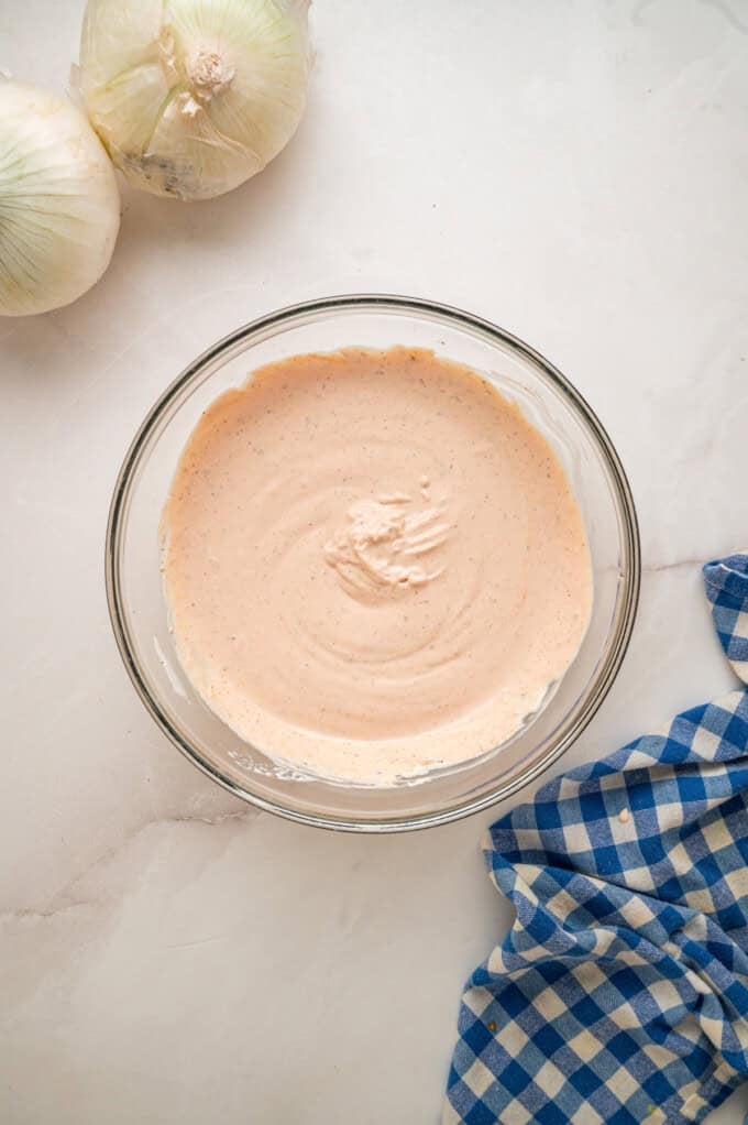 This copycat Outback Steakhouse Blooming Onion Sauce is creamy, tangy, and spicy, and ready in just 5 minutes. Blooming onion dipping sauce n a bowl