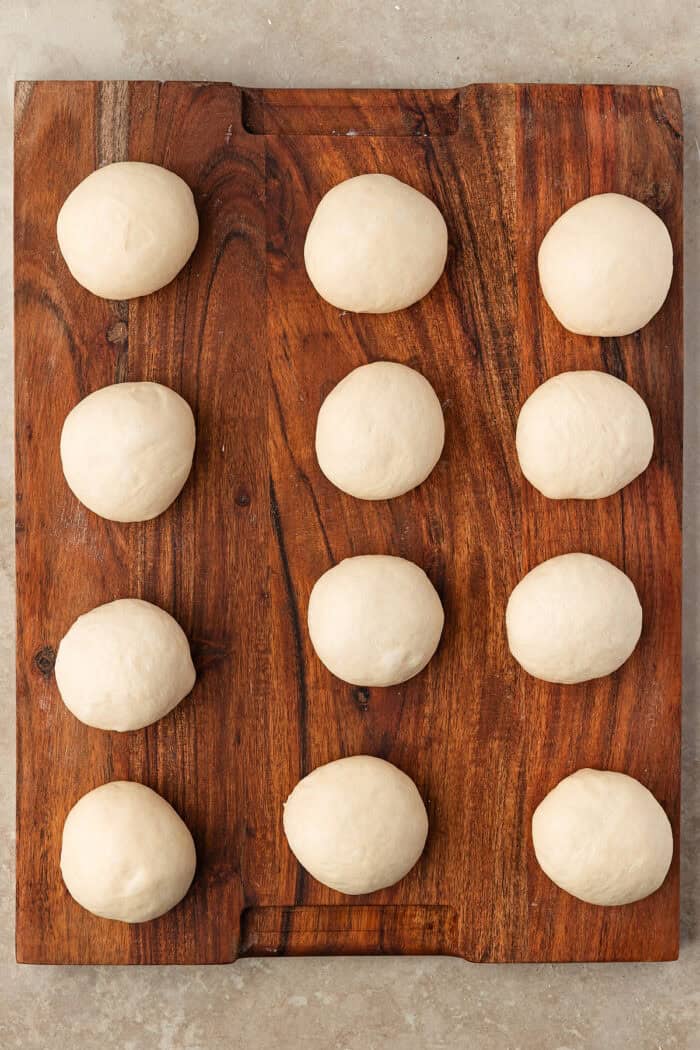 These Sourdough English Muffins are soft, chewy, and full of the classic nooks and crannies everyone loves. Dough divided into twelve balls