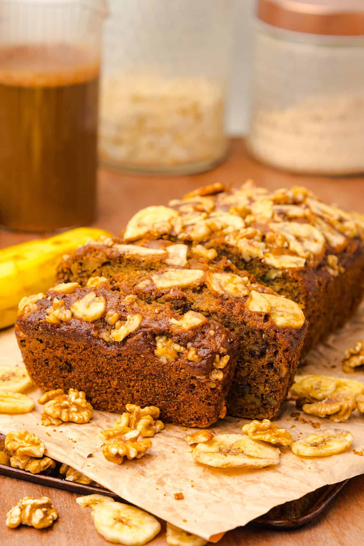 This copycat Starbucks Banana Bread is soft and moist, with lots of sweet banana flavor and warm spices. One bowl + 15 minutes! Copycat Starbucks banana bread on a cutting board