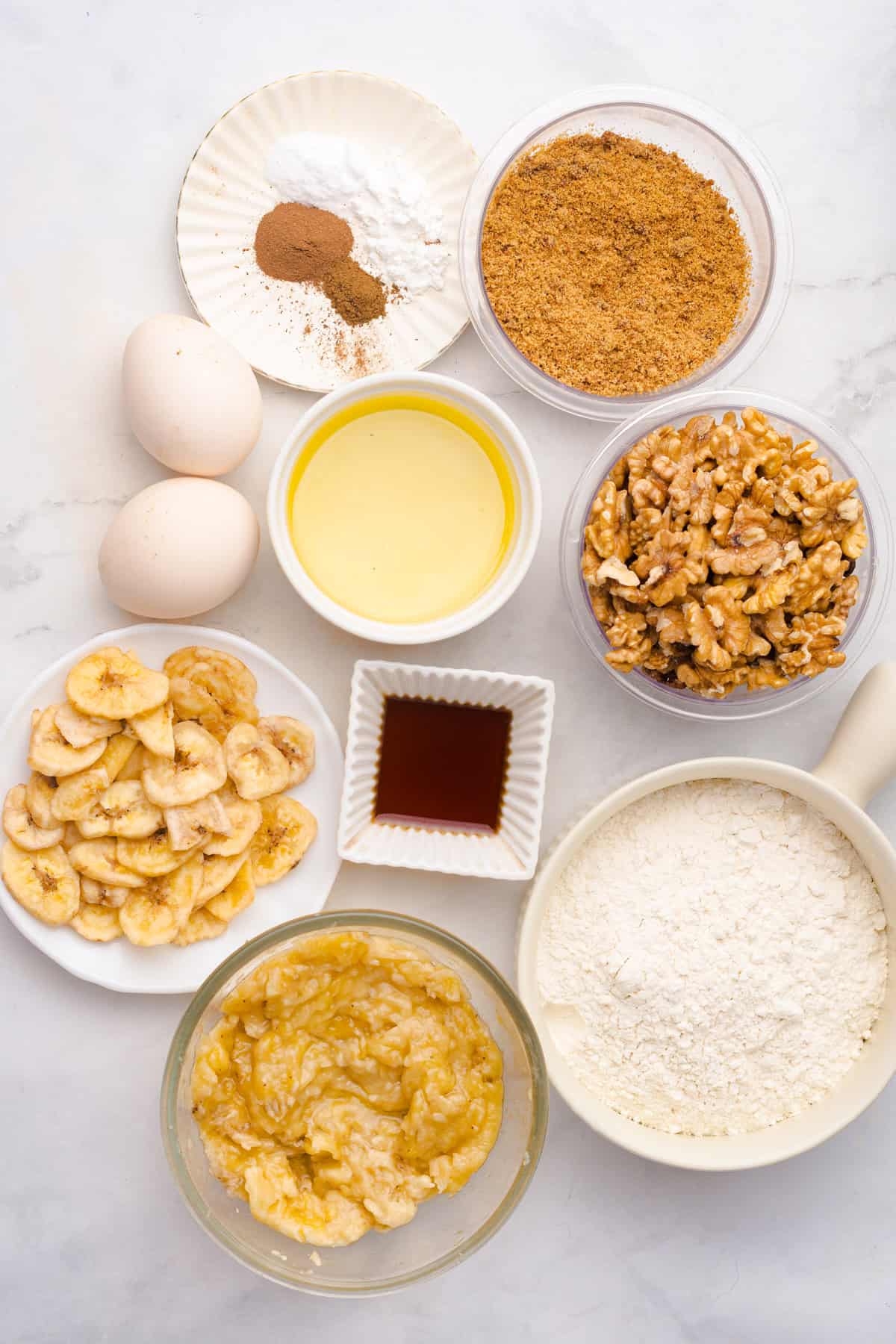 This copycat Starbucks Banana Bread is soft and moist, with lots of sweet banana flavor and warm spices. One bowl + 15 minutes! Overhead view of ingredients needed to make Starbucks banana bread