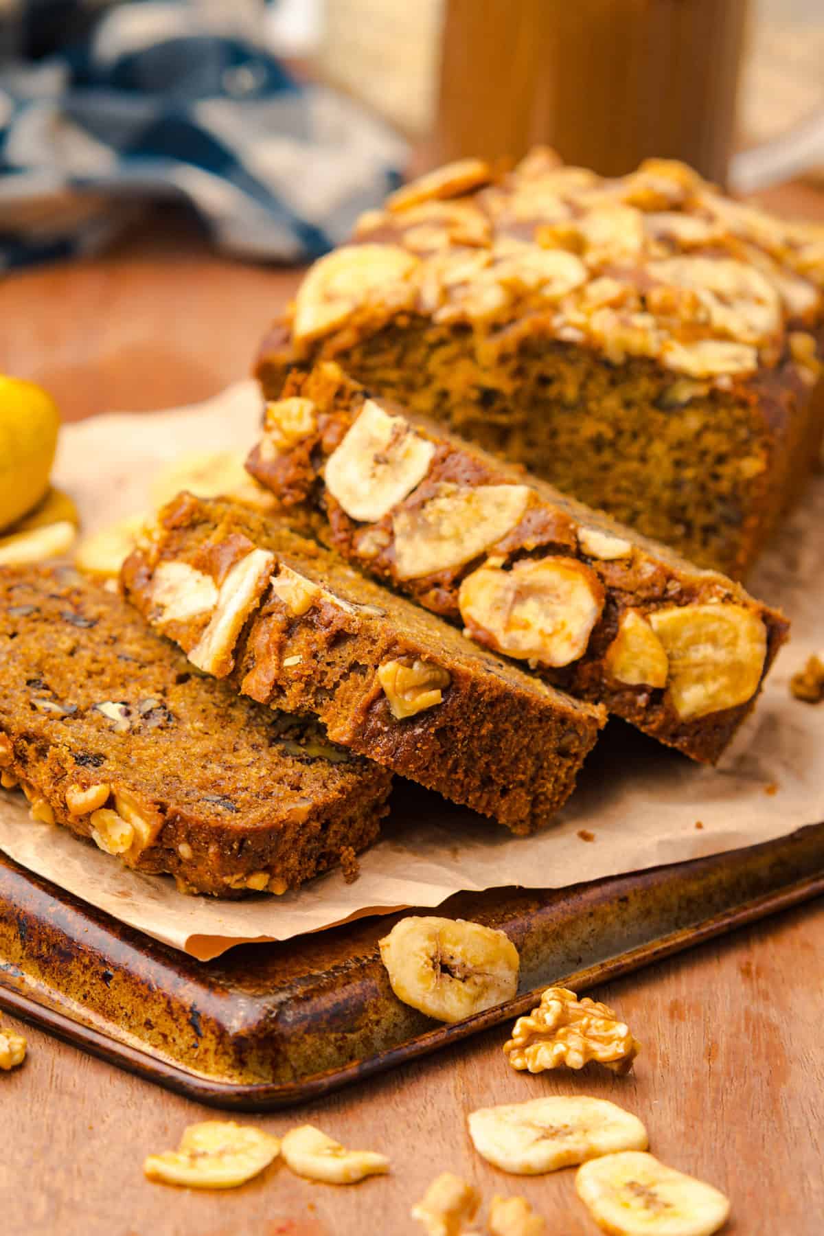 This copycat Starbucks Banana Bread is soft and moist, with lots of sweet banana flavor and warm spices. One bowl + 15 minutes! A loaf of Starbucks banana bread half sliced on a cutting board