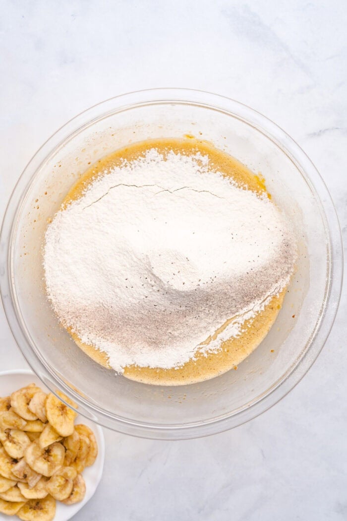 This copycat Starbucks Banana Bread is soft and moist, with lots of sweet banana flavor and warm spices. One bowl + 15 minutes! Adding sifted dry ingredients to the wet batter