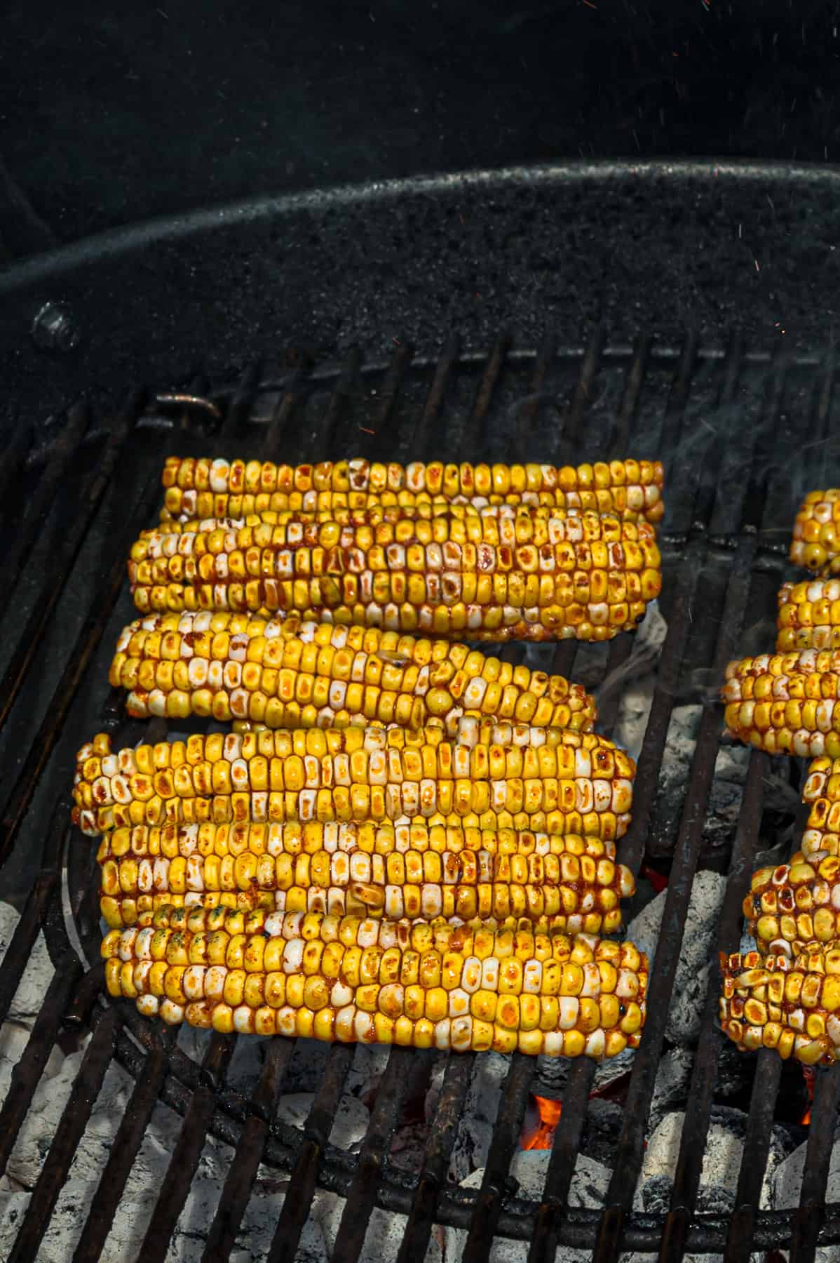 These easy Corn Ribs are coated in warm, smoky spices, cooked in the air fryer or grill, drizzled with lime crema. Corn ribs on the grill