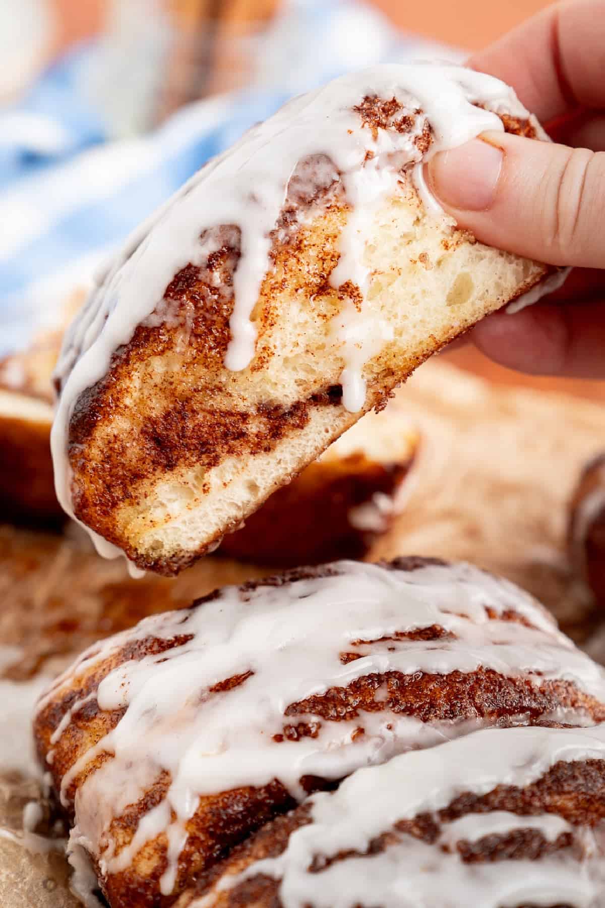 This Dollywood Cinnamon Bread copycat recipe has a buttery, caramelized cinnamon-sugar coating and sweet glaze drizzled over the top. Pulling up a slice of Dollywood cinnamon bread from the loaf