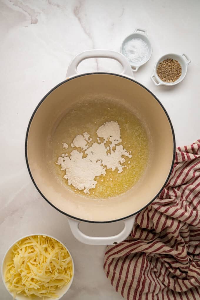 Tender shell pasta is coated in a thick, creamy white cheddar cheese sauce in this copycat Panera Mac and Cheese recipe. Melted butter and flour in a pot