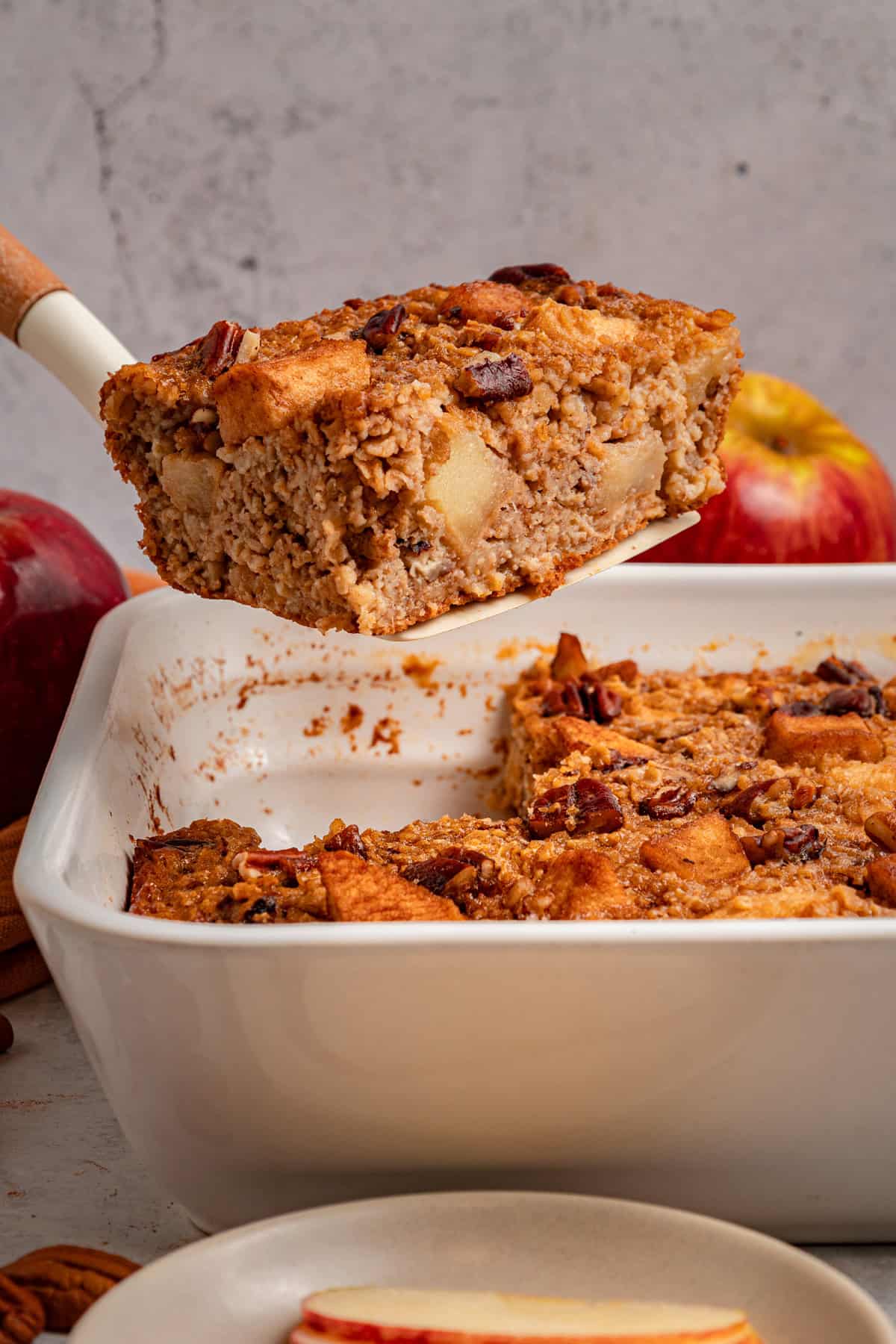 Serving a slice of baked apple oatmeal 
