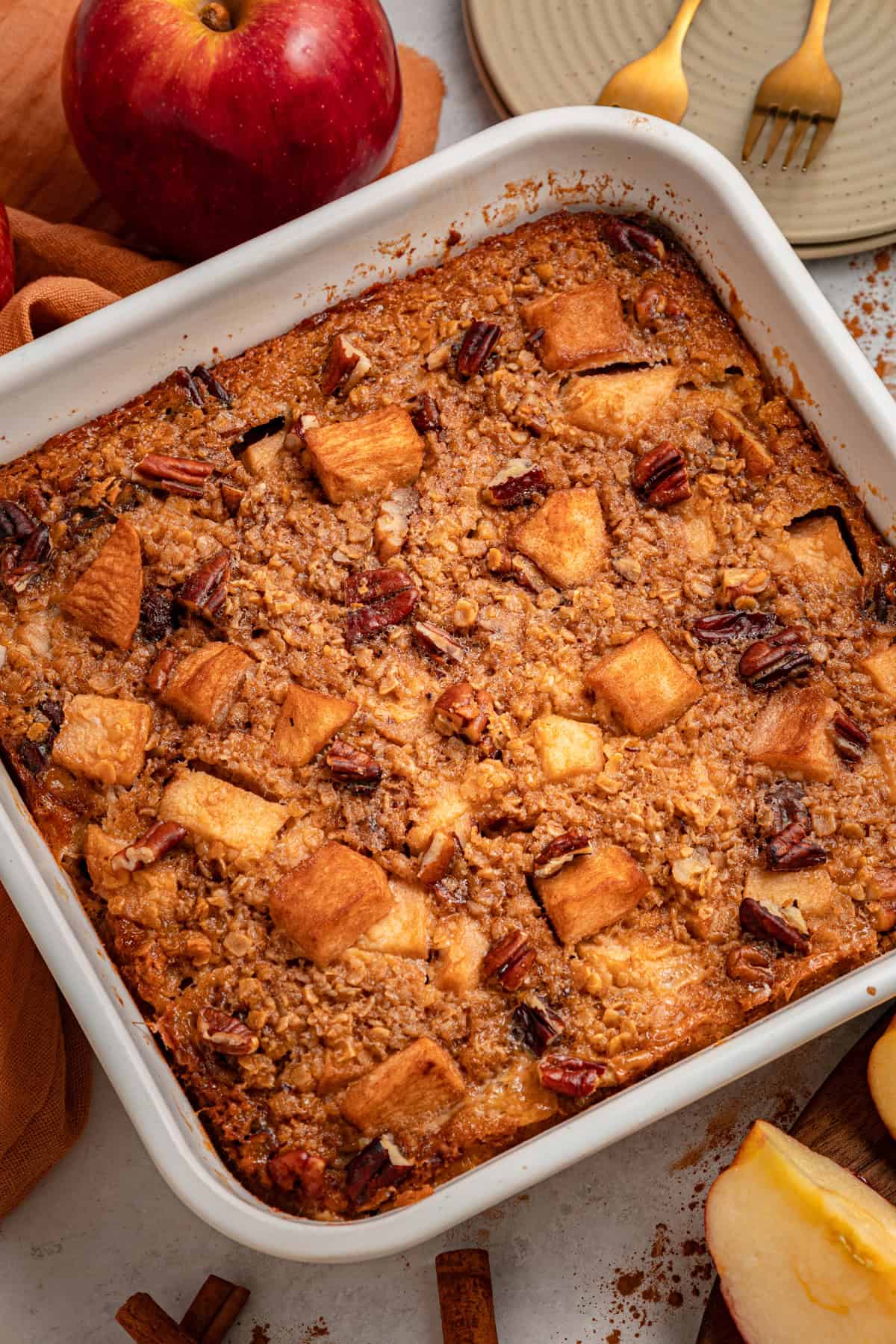 With tender, caramelized apples and lightly spiced maple syrup oats, this Baked Apple Oatmeal is the perfect fall breakfast. Overhead view of a pan of baked apple oatmeal