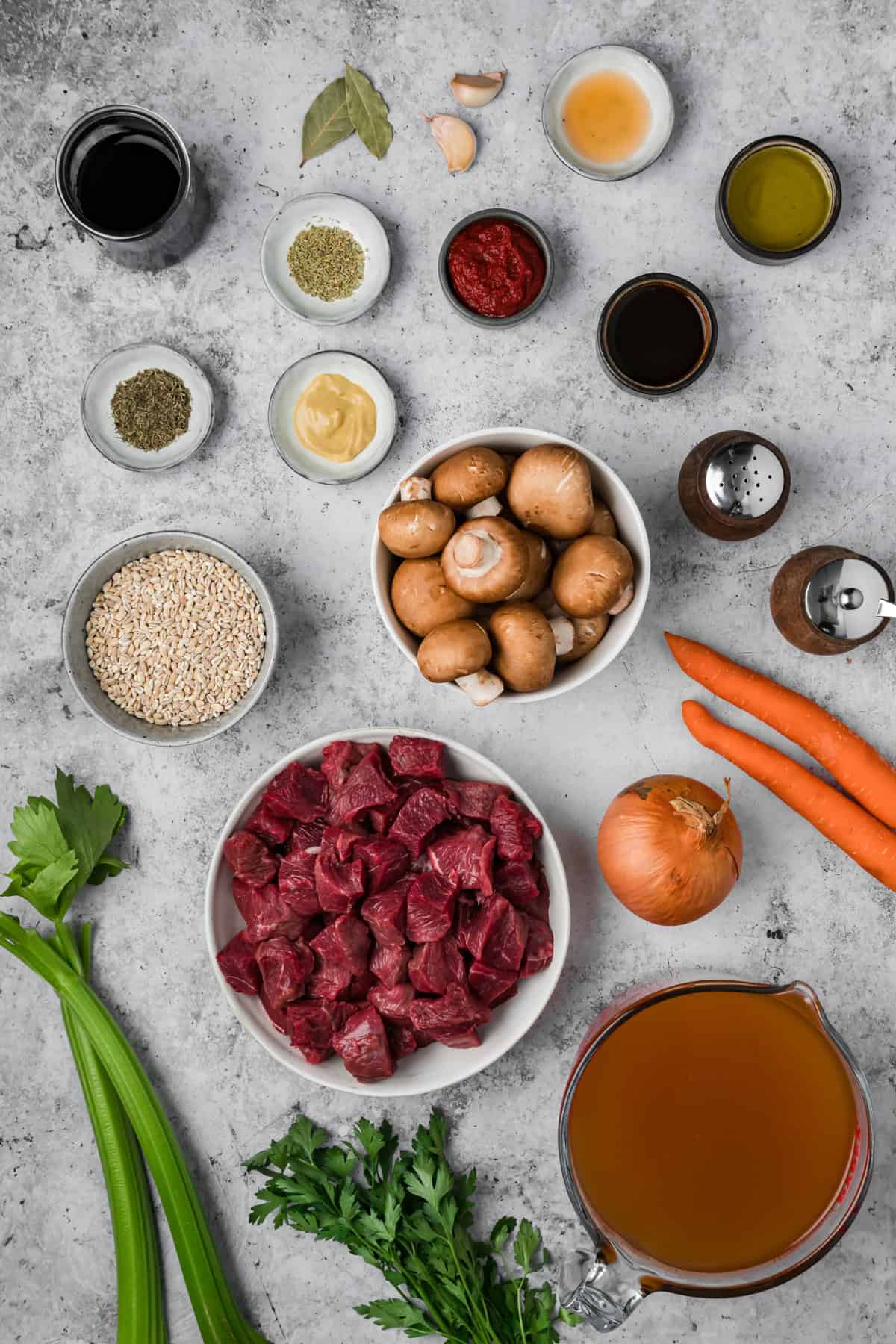 This hearty Beef Barley Mushroom Soup is nourishing, comforting, and perfect for chilly nights, with tender pieces of beef. Overhead view of ingredients needed to make beef barley mushroom soup