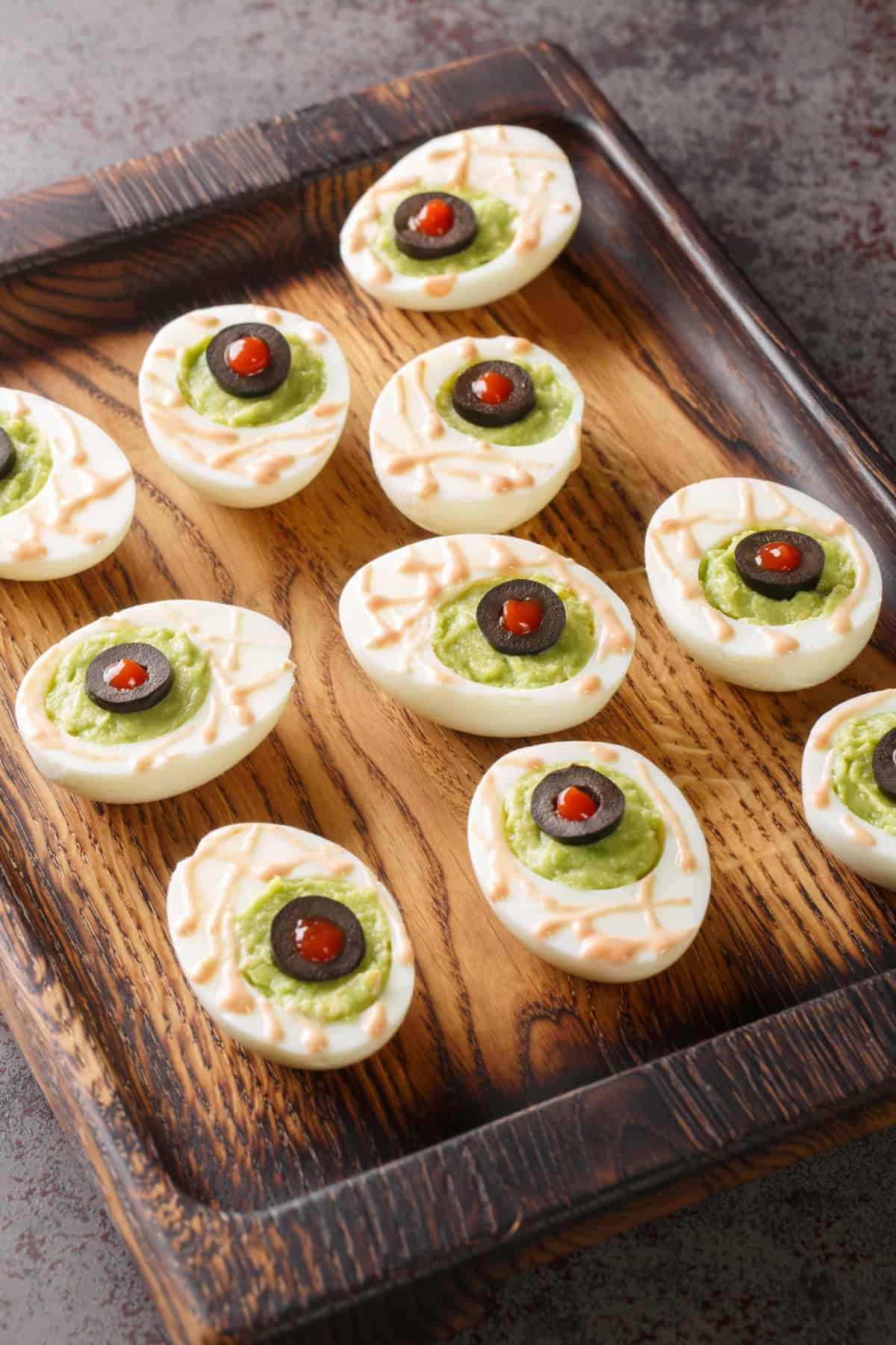 These Halloween Deviled Eggs are a fun and spooky appetizer for Halloween parties! Eyeball Deviled Eggs
