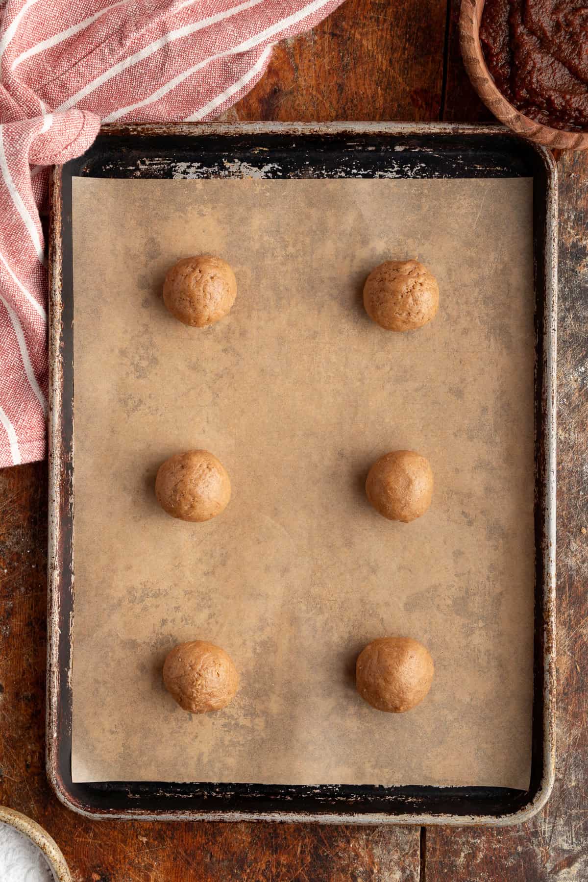 These Apple Cider Cookies are soft and chewy with plenty of warm fall flavor. balls of cookie dough on a baking sheet