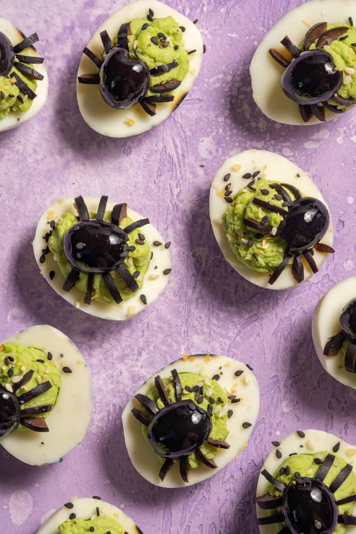 These Halloween Deviled Eggs are a fun and spooky appetizer for Halloween parties! Avocado Spider Deviled Eggs
