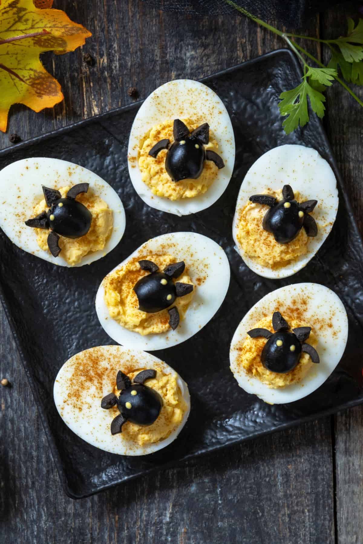These Halloween Deviled Eggs are a fun and spooky appetizer for Halloween parties! Halloween Bat Deviled Eggs