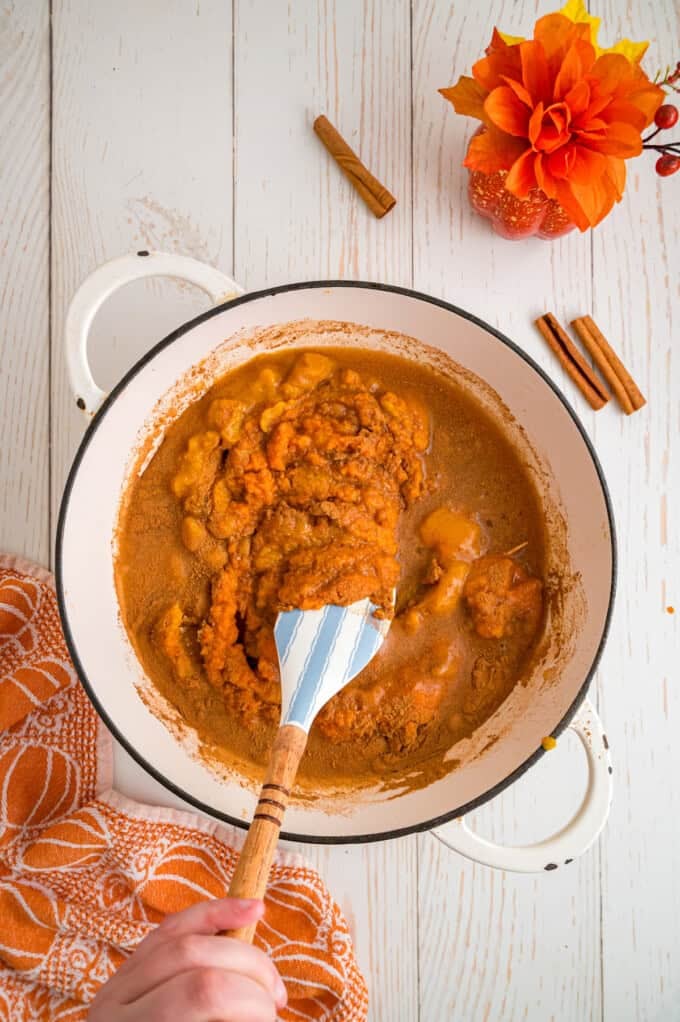 Made with pumpkin puree, brown sugar, maple syrup, and warm spices, you’ll want to spread this Pumpkin Butter on everything. Stirring pumpkin butter ingredients in a pan