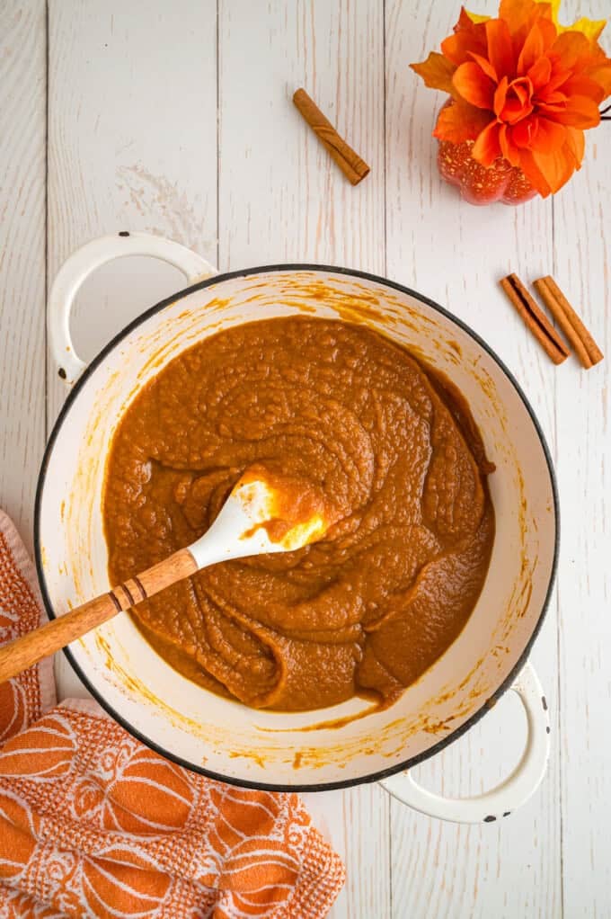 Made with pumpkin puree, brown sugar, maple syrup, and warm spices, you’ll want to spread this Pumpkin Butter on everything. Stirring pumpkin butter in a pan