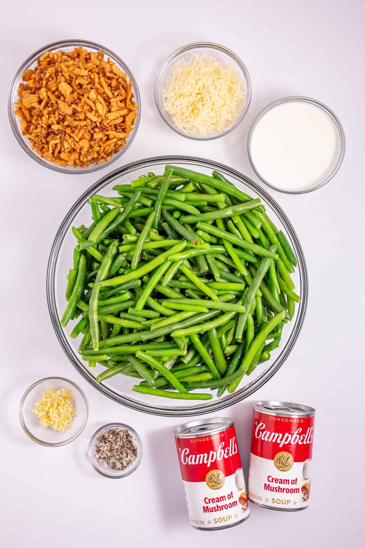 This Slow Cooker Green Bean Casserole is the perfect hands-off side dish for the holidays! Made with just a few ingredients. Overhead view of ingredients needed to make slow cooker green bean casserole