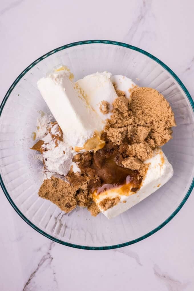 A creamy cookie butter cheesecake filling is baked in a Biscoff crust and topped with more cookie butter in this Biscoff Cheesecake recipe. Cream cheese, cookie butter, and sugars in a mixing bowl