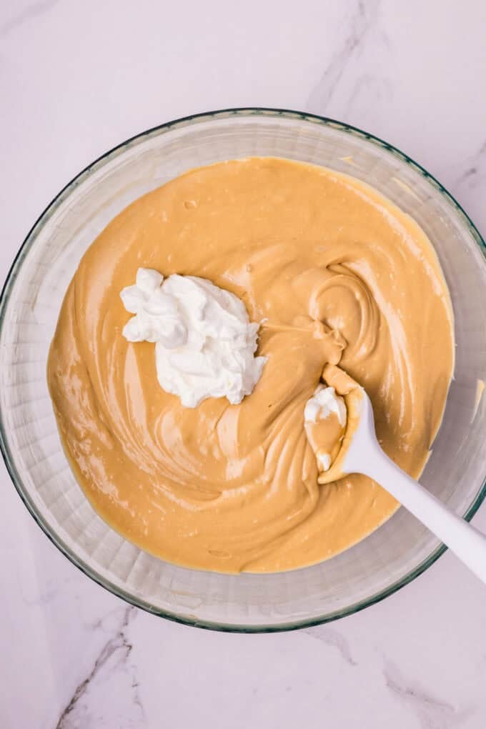 A creamy cookie butter cheesecake filling is baked in a Biscoff crust and topped with more cookie butter in this Biscoff Cheesecake recipe. Mixing sour cream into cheesecake filling