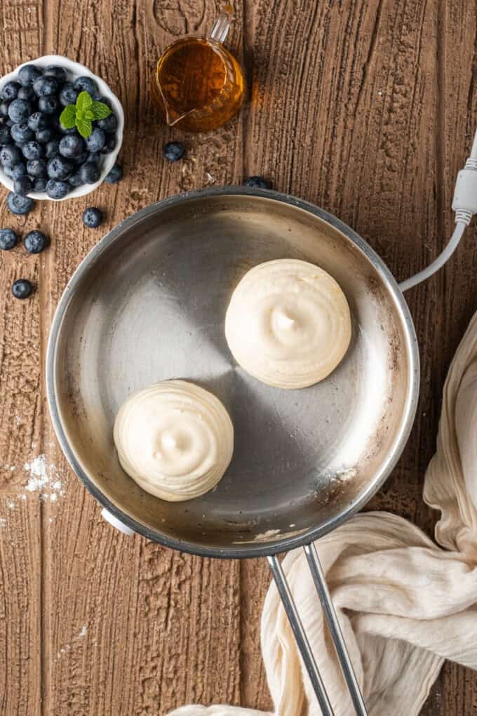 These Japanese Soufflé Pancakes are tall, fluffy, jiggly, and unbelievably soft, thanks to the meringue in the batter. Japanese souffle pancake batter in a pan