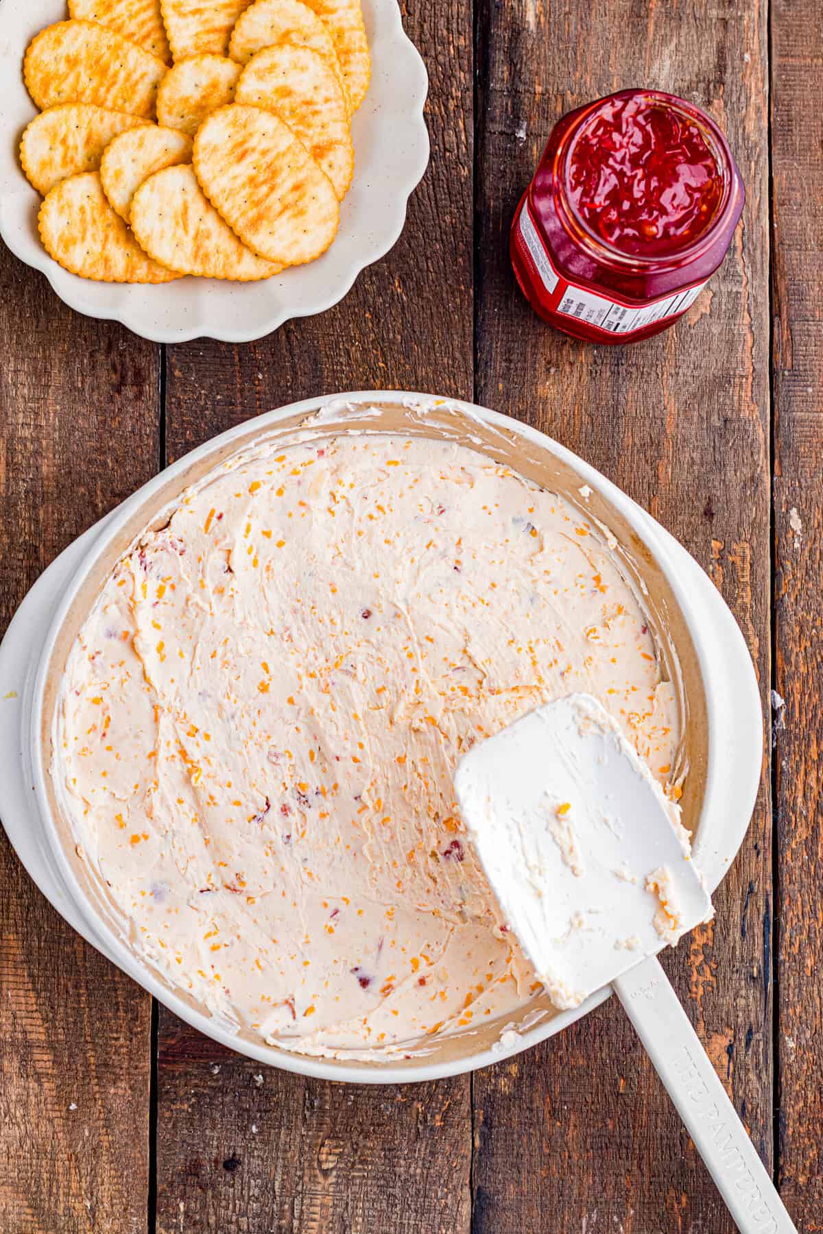 The cream cheese mixture spread in the baking dish