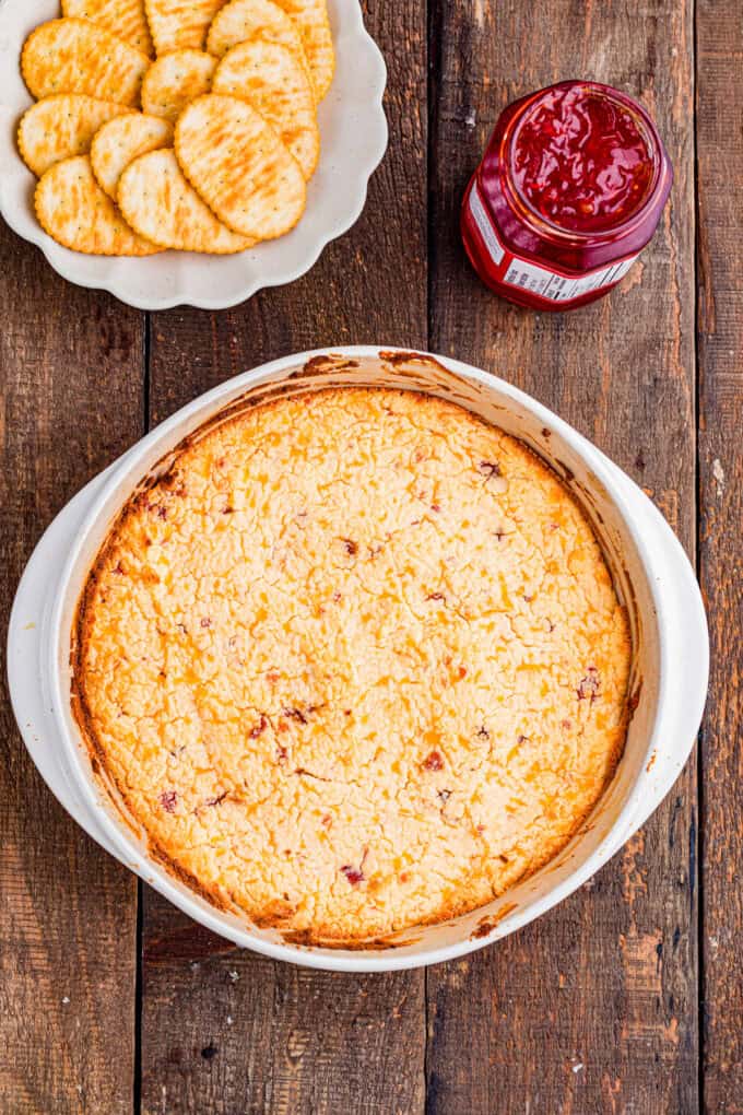 This easy Pepper Jelly Cream Cheese Dip is creamy, cheesy, smoky, and perfectly sweet and spicy! Perfect for holidays & game days. The cream cheese mixture in the baking dish after baking