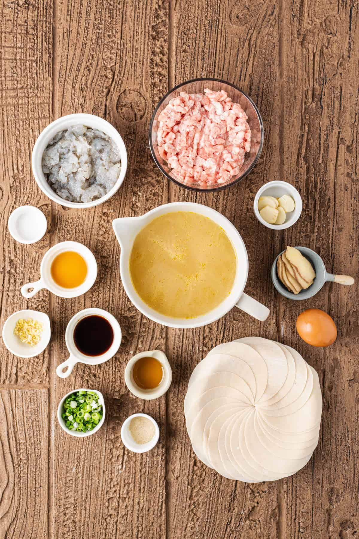 This easy Wonton Soup features tender homemade wontons filled with juicy pork and shrimp in a light, aromatic chicken broth. Overhead view of ingredients needed to make wonton soup
