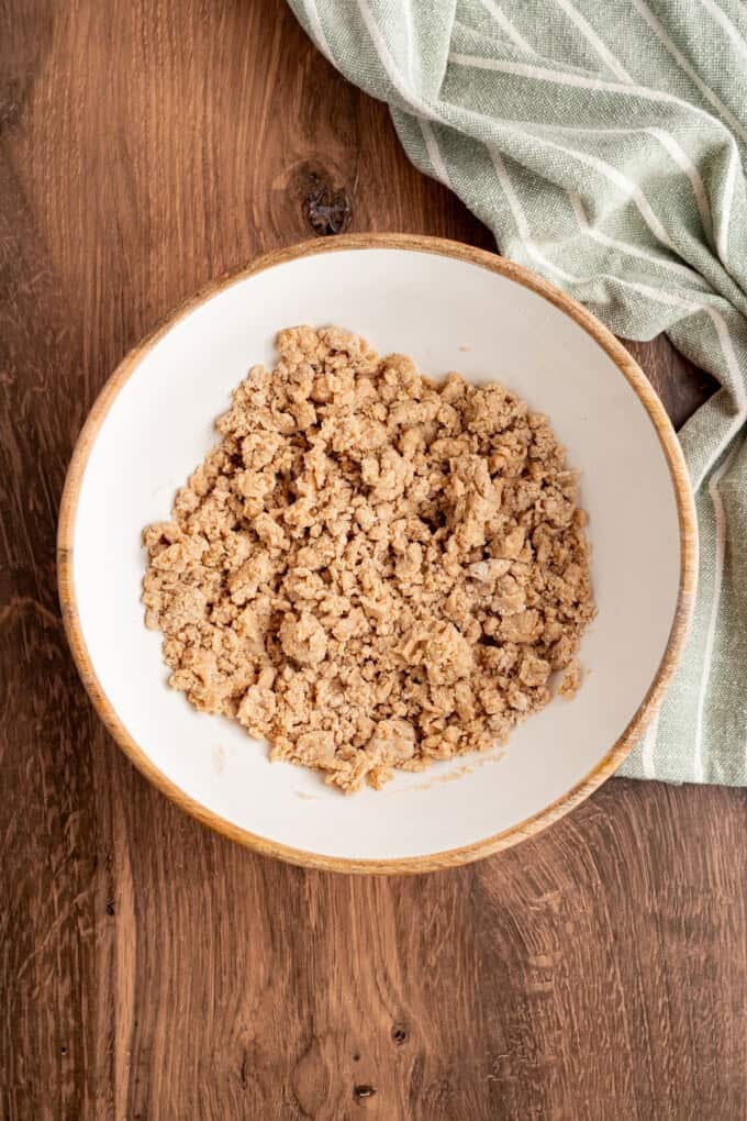 Tender spiced apple filling is topped with a snickerdoodle batter to make this irresistible Apple Cobbler recipe. Cobbler topping in a bowl