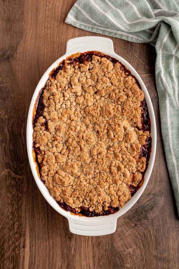 Tender spiced apple filling is topped with a snickerdoodle batter to make this irresistible Apple Cobbler recipe. Overhead view of apple cobbler