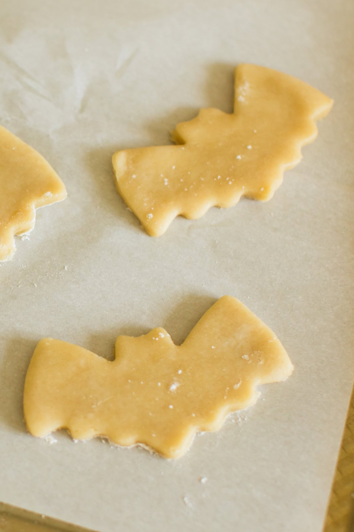 These Halloween Sugar Cookies are soft, buttery cut-out cookies decorated with colorful icing for a fun and festive Halloween treat. bat shapes with the sugar cookie dough.