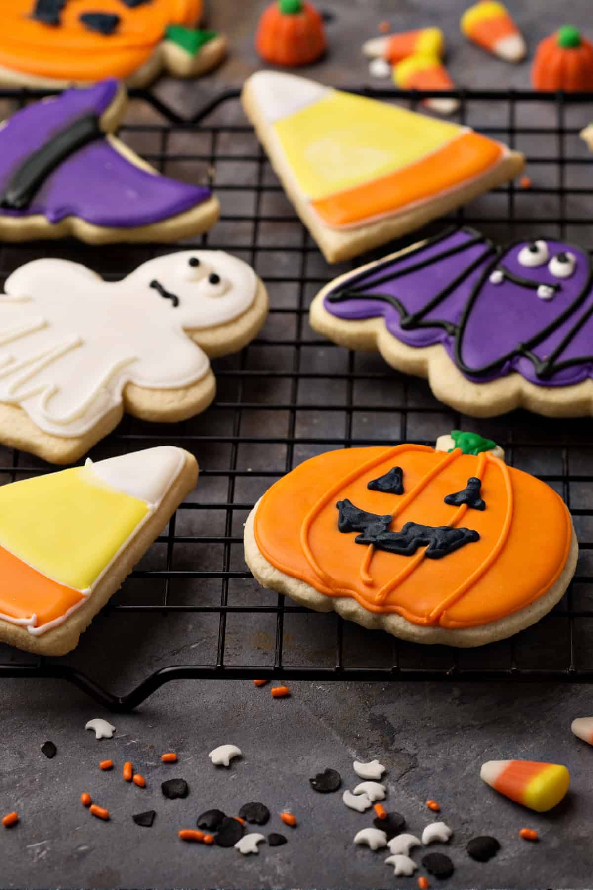 These Halloween Sugar Cookies are soft, buttery cut-out cookies decorated with colorful icing for a fun and festive Halloween treat. Halloween Sugar Cookies on a wire rack.